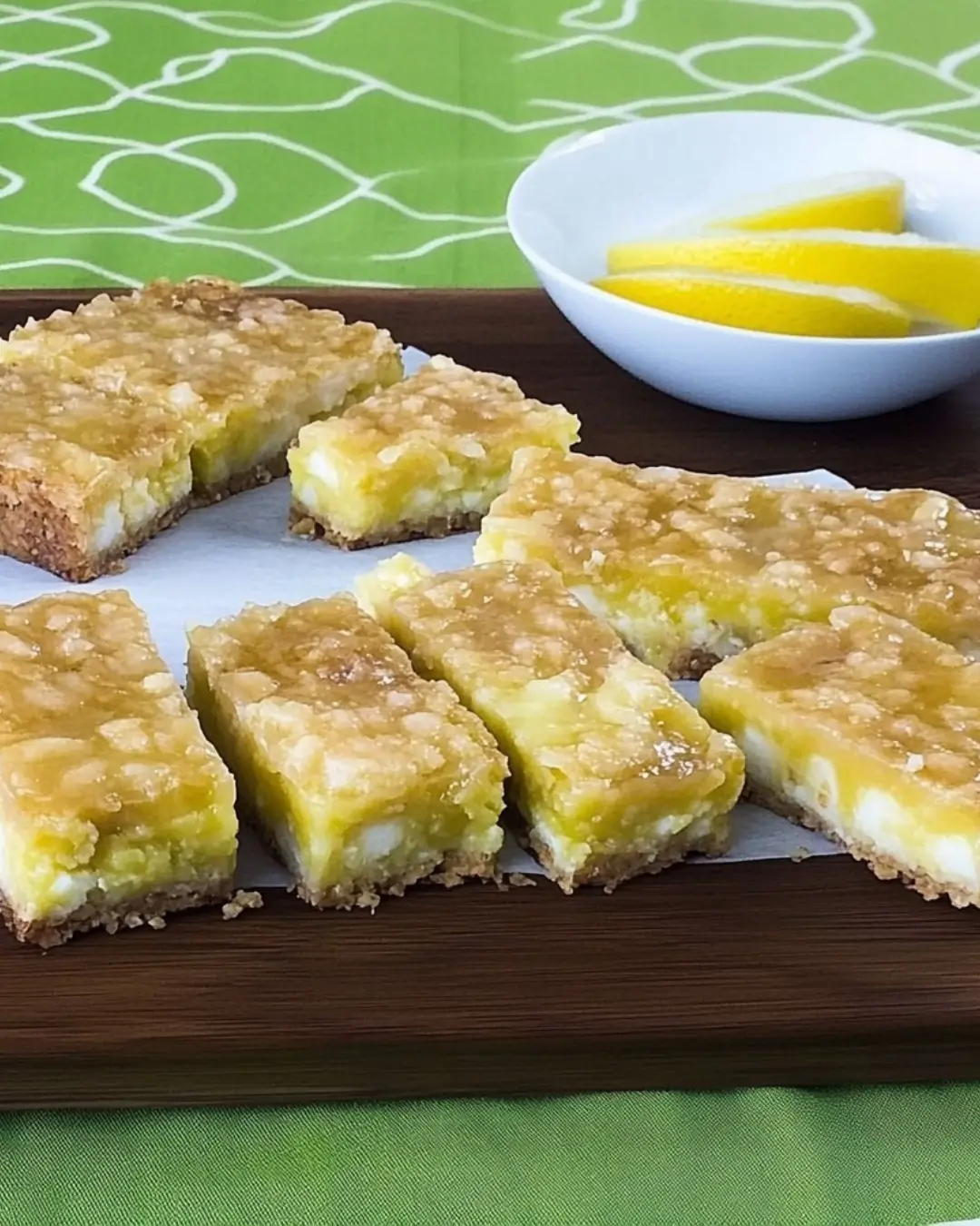 Neatly sliced sugar-free coconut lime bars on serving board